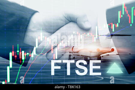 FTSE 100 Financial Times Stock Exchange Index United Kingdom UK England Investment Trading concept with chart and graphs. Stock Photo