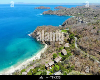 PAPAGAYO, COSTA RICA -18 MAR 2019- Aerial view of the Four Seasons Resort Costa Rica and the Peninsula Papagayo during the dry season in Guanacaste. Stock Photo