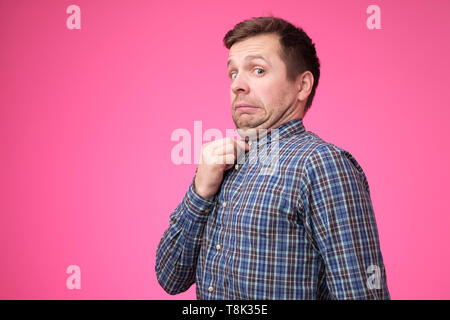 young man in blue shirt with a double chin. Stock Photo