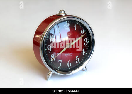 Vintage alarm clock, isolated on white background, close-up Stock Photo