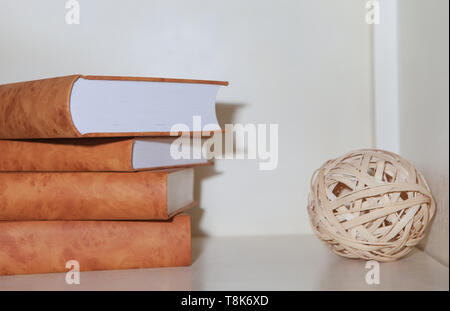 A set of books on the bookshelf, decorative minimalism Stock Photo