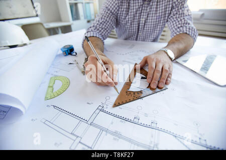 Engineer Drawing Plans  Closeup Stock Photo