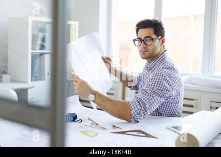 Handsome Engineer at Workplace Stock Photo