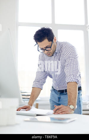 Middle-Eastern Man Working in Office Stock Photo