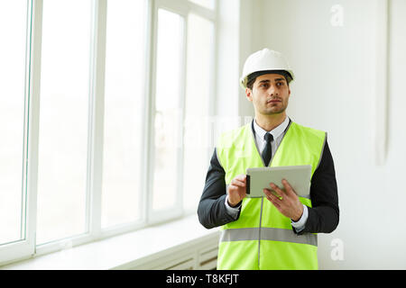 Engineer Holding Tablet Stock Photo