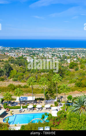 Beautiful Mediterranean landscape in Cypriot Bellapais, Kyrenia region, Northern Cyprus taken on a sunny day. The small coastal city is a popular summer vacation destination. Stock Photo
