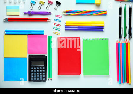 Composition with different school stationery and calculator on white background Stock Photo