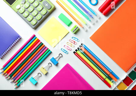 Composition with different school stationery and calculator on white background Stock Photo