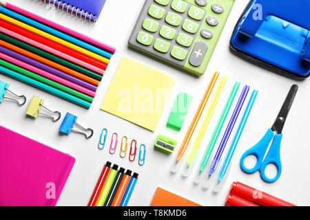 Composition with different school stationery and calculator on white background Stock Photo