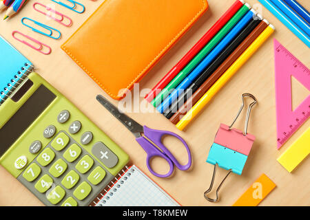 Composition with different school stationery and calculator on wooden background Stock Photo