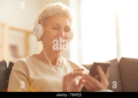 Senior Woman Using Technology Stock Photo