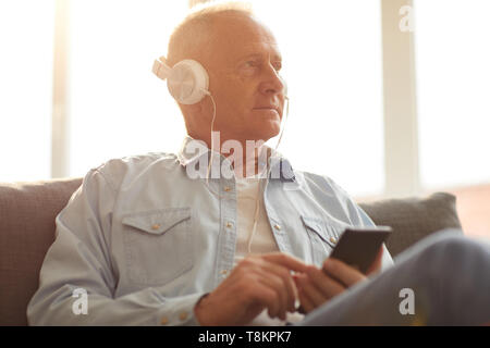 Senior Man  Listening to Music Stock Photo