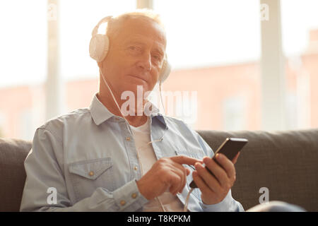 Senior Man Using Technology Stock Photo