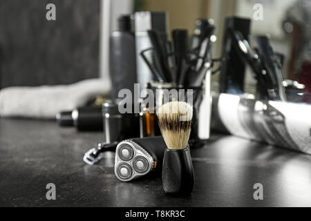 Set for shaving on grey table in salon Stock Photo