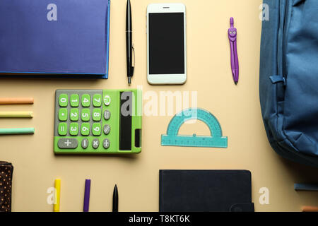 Composition with different school stationery and phone on light background Stock Photo