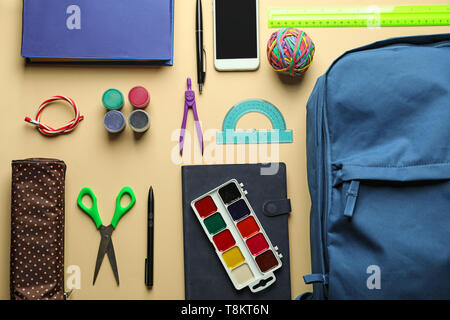Composition with different school stationery and phone on light background Stock Photo
