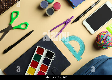 Composition with different school stationery and phone on light background Stock Photo