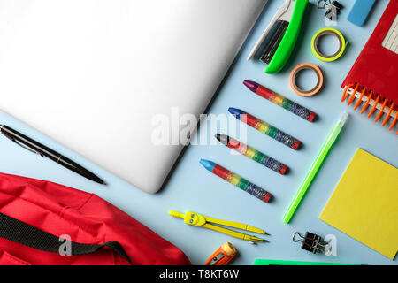 Composition with different school stationery on color background Stock Photo