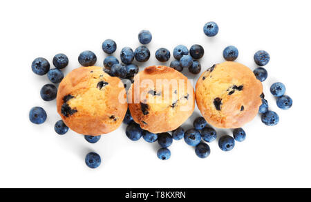 Tasty blueberry muffins on white background Stock Photo