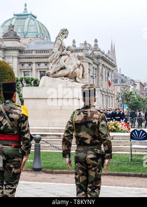 STRASBOURG, FRANCE - MAY 8, 2017: Ceremony to mark Western allies World War Two victory Armistice in Europe soldiers in front of Monument aux morts de Strasbourg Stock Photo