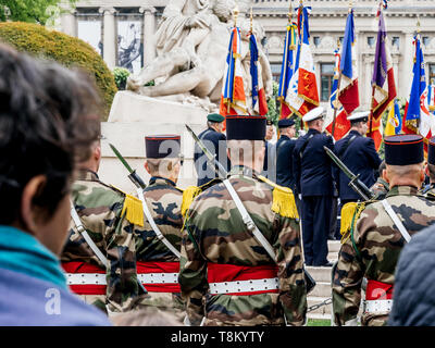 STRASBOURG, FRANCE - MAY 8, 2017: Rear view of soldiers at ceremony to mark Western allies World War Two victory Armistice in Europe marking the 72nd anniversary of victory Stock Photo