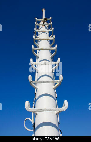 White post of lightning rod on ferry boat against clear blue sky Stock Photo