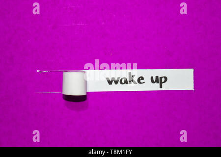 Wake up text, Inspiration, Motivation and business concept on purple torn paper Stock Photo