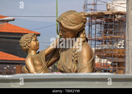 Skopje, Macedonia - September 17, 2012: Bronze Statue of Mother and Child Fountain During Construction in Skopje, Macedonia. Stock Photo