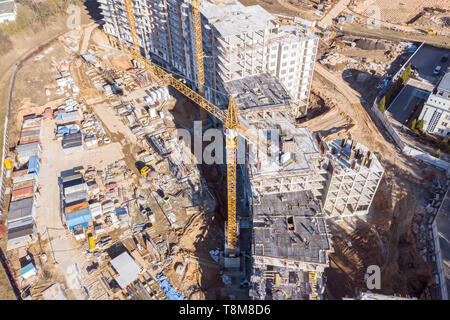 aerial top view of city construction site with tower cranes and other building machinery Stock Photo
