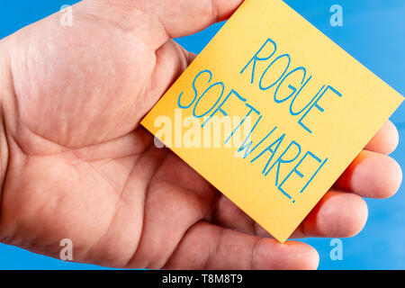 Handwriting text Rogue Software. Conceptual photo type of malware that poses as antimalware software Stock Photo