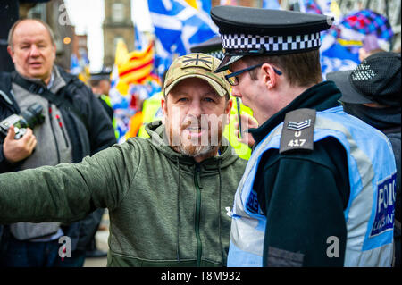 A member of the Pro-Union side is seen during a heated argument with a Police Scotland officer during the counter-protest. Thousands of Scottish independence supporters marched through Glasgow as part of the ‘all under one banner’ (AUOB) protest, as the coalition aims to run such event until Scotland is ‘free’. Stock Photo
