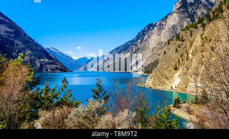 Green waters of Seton Lake on the foot of Mount McLean near Lillooet. Seton Lake is located along Highway 99, or the Duffey Lake Road, in BC Canada Stock Photo