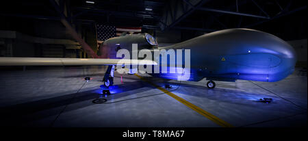 An RQ-4 Global Hawk stationed at Grand Forks Air Force Base, North Dakota is proudly displayed May 11, 2019. Grand Forks AFB will soon be known as America's Global Hawk Base when the 319th Air Base Wing is re-designated as the 319th Reconnaissance Wing, June 28, 2019. The re-designation, initiated by Commander Air Combat Command Gen. Mike Holmes, aligns Grand Forks AFB's host wing and the 69th Reconnaissance Group. The 69 RG, which flies the high-altitude, remotely-piloted RQ-4 Global Hawk aircraft, has been aligned under the 9th Reconnaissance Wing at Beale Air Force Base, California, since i Stock Photo