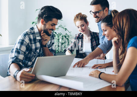 Young architects working on project in office Stock Photo