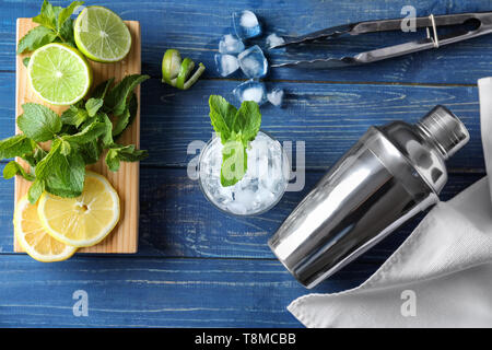 Cocktail shaker and ingredients for mojito on wooden table Stock Photo