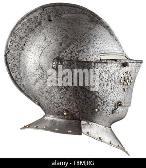 A cuirassier helmet, Flemish/French, circa 1600 Two-piece skull with tall, turned comb. Two-piece pivoted visor with lateral hook-and-eye closure and separated vision slits. The obverse with circular ventilation holes decorated with brass rivets. Pivoted bevor with riveted collar. Several repairs at the comb and visor hinge on the right, both pieces of the gorget added. Height 32 cm. historic, historical, defensive arms, weapons, arms, weapon, arm, fighting device, object, objects, stills, clipping, clippings, cut out, cut-out, cut-outs, utensil,, Additional-Rights-Clearance-Info-Not-Available Stock Photo