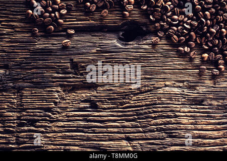 Top of view coffee beans on rustic oak table Stock Photo