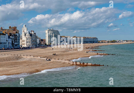 The sea front at Eastbourne showing the pebbled beach. Photo taken from Eastbourne Pier. Completed in 1872. Stock Photo