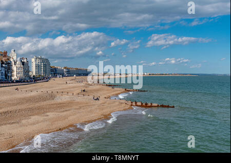 The sea front at Eastbourne showing the pebbled beach. Photo taken from Eastbourne Pier. Completed in 1872. Stock Photo