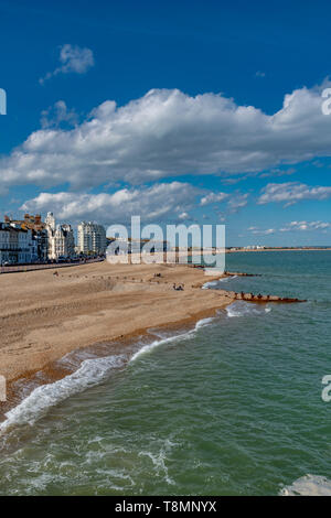 The sea front at Eastbourne showing the pebbled beach. Photo taken from Eastbourne Pier. Completed in 1872. Stock Photo