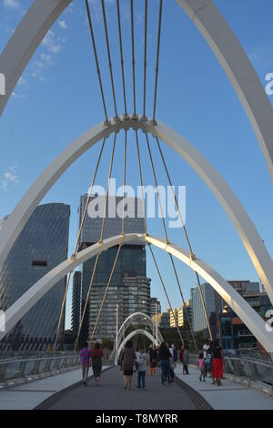 Arches and cables of pedestrian Seafarers Bridge across Yarra River in Melbourne. Stock Photo