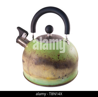 Kettle damaged by fire from a gas stove. Isolated on a white background Stock Photo