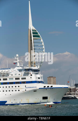 Portsmouth, England, UK> May 2019. Cross channel roro ferry Normandie underway  passing the Spinacker Tower. Stock Photo
