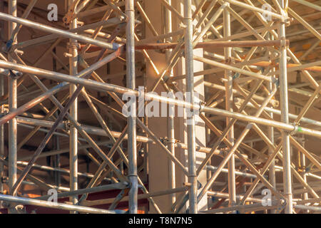 steel scaffolding mounted for the construction of a building. Building activity. City and urban life Stock Photo