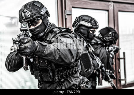 Police special operations forces fighters on raid Stock Photo