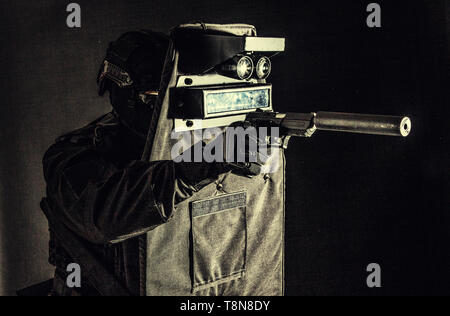 https://l450v.alamy.com/450v/t8n8dy/armed-swat-fighter-hiding-behind-ballistic-shield-t8n8dy.jpg