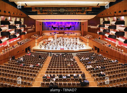 Interior of the Royal Festival Hall on London's South Bank (opened in 1951). Audience taking their seats for a classical concert. Stock Photo