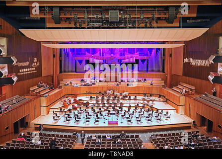 Interior of the Royal Festival Hall on London's South Bank (opened in 1951). Audience taking their seats for a classical concert. Stock Photo