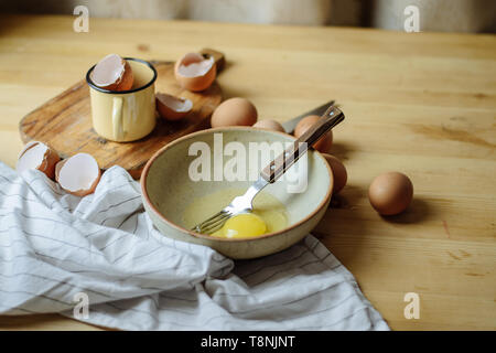 broken eggs in a plate. Beautiful still life, preparing for the text and cooking scrambled eggs Stock Photo