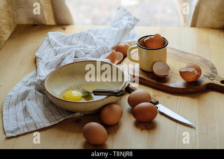 broken eggs in a plate. Beautiful still life, preparing for the text and cooking scrambled eggs Stock Photo